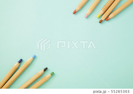 Colorful pencils on pastel pale blue 55265303