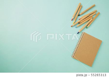 Crayon With a notebook on blue 55265313