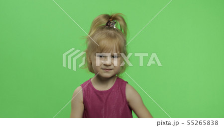 Disappointed blonde girl in purple dress. Pretty little blonde child. Chroma Key 55265838
