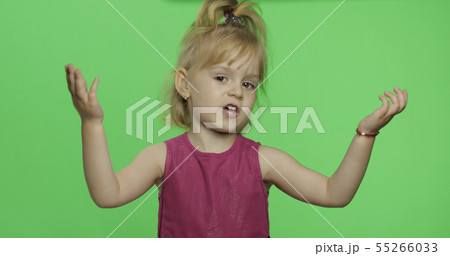 Girl in purple dress tells something with expression. Blonde child. Chroma Key 55266033