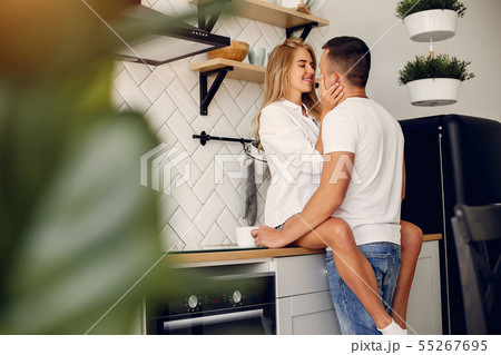 Beautiful couple spend time in a kitchen 55267695