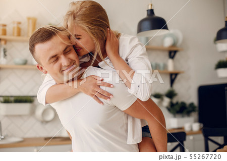 Beautiful couple spend time in a kitchen Beautiful couple spend time in a kitchen 55267720