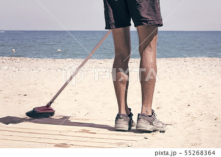 The service personnel carries out beach cleaning on the sea coast. The service personnel carries out beach cleaning on the sea coast. 55268364