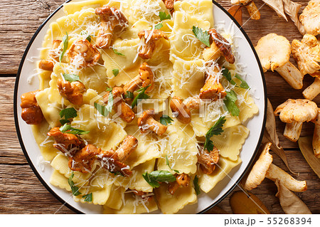 Italian ravioli with chanterelles and parmesan 55268394