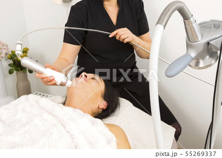 Woman get face treatment at beauty clinic 55269337