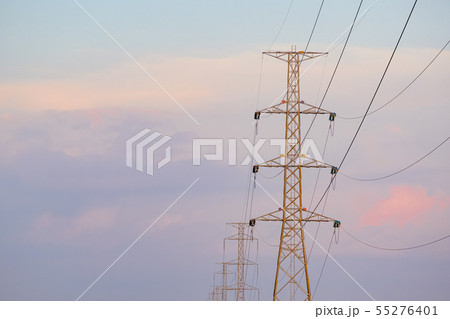 High voltage tower  and line cables, in sunset sky 55276401