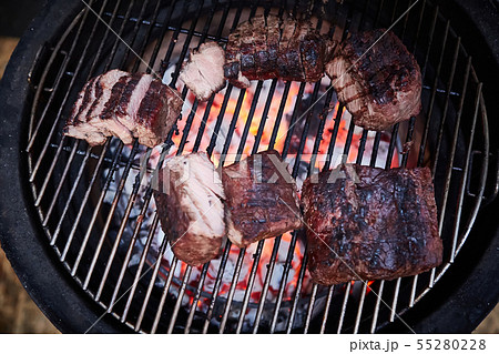 Roast beef at barbecue. Low temperature grilling barbecue. Roast beef at barbecue. Low temperature grilling barbecue. 55280228