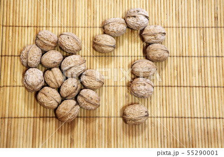 walnut question mark wooden background  55290001