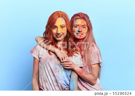 tired pretty girls having a rest during the festival 55290324