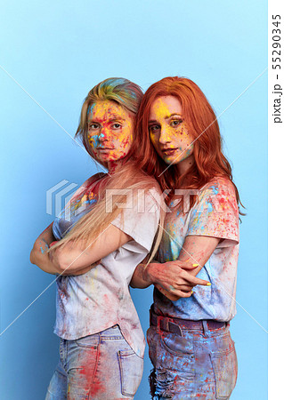 serious girls with crossed arms posing to the camera serious girls with crossed arms posing to the camera 55290345