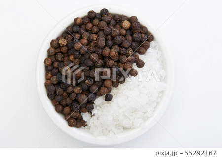 Bowl of black pepper with salt on white Bowl of black pepper with salt on white 55292167
