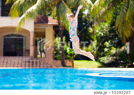 Child in swimming pool. Summer vacation with kids. Child in swimming pool. Summer vacation with kids. 55292207