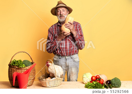 Grandfather picked up fresh harvest and basket with fresh-laid eggs Grandfather picked up fresh harvest and basket with fresh-laid eggs 55292566