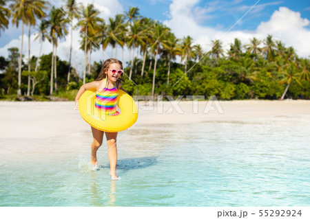 Kids play on tropical beach. Sand and water toy. Kids play on tropical beach. Sand and water toy. 55292924