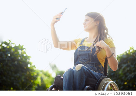 good looking fashion girl looking at the screen of her mobile phone 55293061