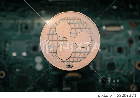 bronze Ripple coin, on background of computer 55293371