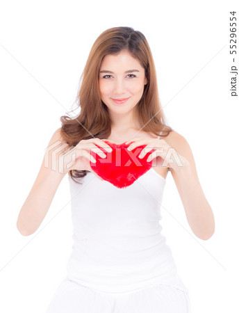 Beautiful asian young woman holding heart shape Beautiful asian young woman holding heart shape 55296554
