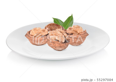 Walnuts  isolated on white plate 55297084