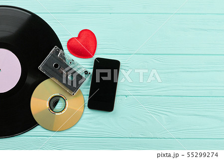 Vintage music devices and smartphone. 55299274