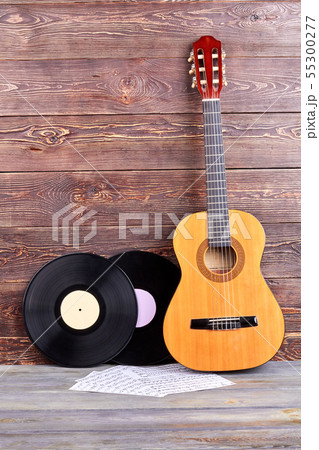 Vinyl records, guitar and musical notes. Vinyl records, guitar and musical notes. 55300277