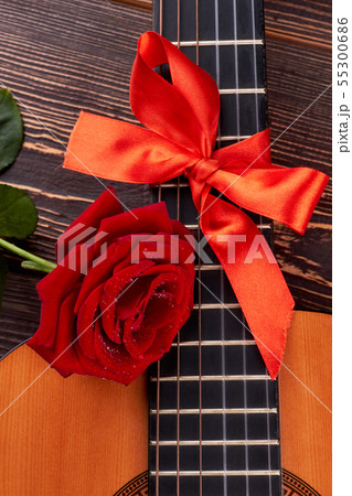 Guitar with red bow. 55300686