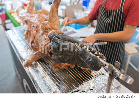 Fried crocodile meat on the barbeque. Street food Fried crocodile meat on the barbeque. Street food 55302537