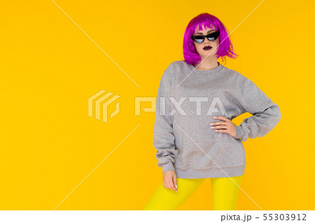 Fashion girl portrait on yellow background. Crazy 55303912