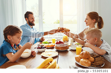 family mother father and children have Breakfast 55305101