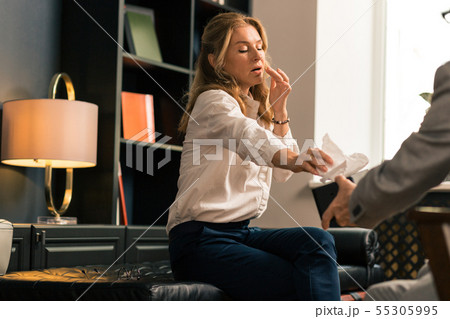 Distressed woman unburdening her heart to a psychotherapist Distressed woman unburdening her heart to a psychotherapist 55305995
