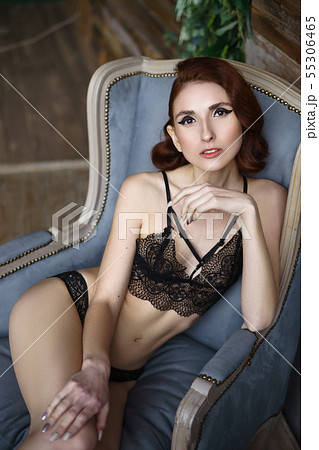 Pretty redhead thin young woman alluring in black Pretty redhead thin young woman alluring in black 55306465