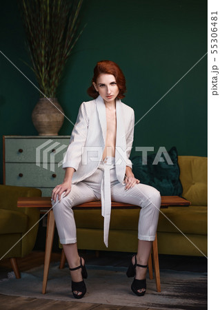 Pretty redhead thin young woman alluring in white Pretty redhead thin young woman alluring in white 55306481