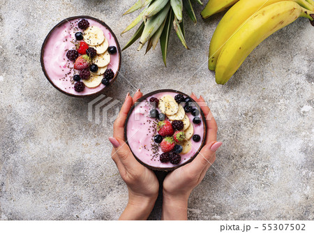 Acai bowl in coconut plate. 55307502
