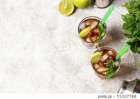 Cuba libre cocktail with mint and lime 55307786