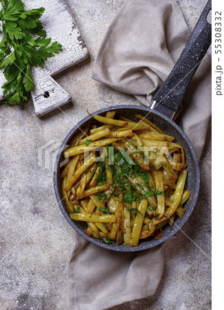 Stewed yellow wax beans in pan Stewed yellow wax beans in pan 55308332