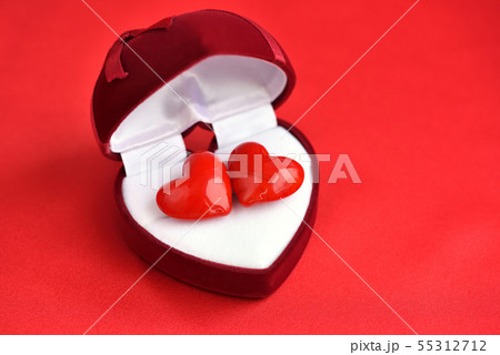 Two decorative hearts are in heart-shaped gift box 55312712