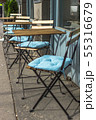 Empty seats in the restaurant on the street.  55316679