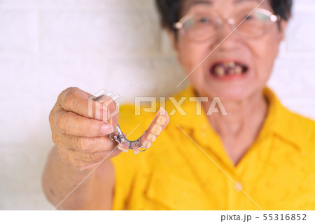 Asian Elderly woman over 70 years old holding Asian Elderly woman over 70 years old holding 55316852