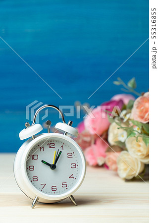 White alarm clock and flowers pink and red rose on White alarm clock and flowers pink and red rose on 55316855
