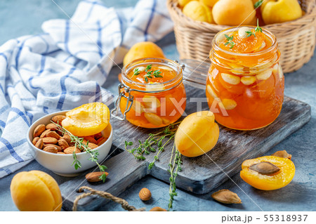 Homemade apricot jam with thyme and sweet almonds. 55318937