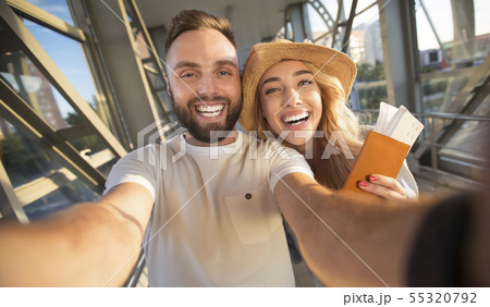 Travelling concept. Couple making selfie at airport terminal 55320792