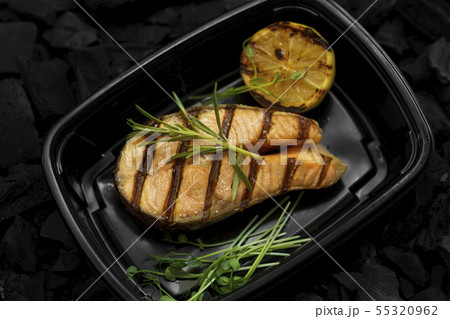 Coal prepared fish for healthy nutrition in take away box Coal prepared fish for healthy nutrition in take away box 55320962