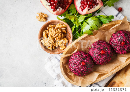 Georgian traditional beet pkhali in wooden bowl. Georgian traditional beet pkhali in wooden bowl. 55321371
