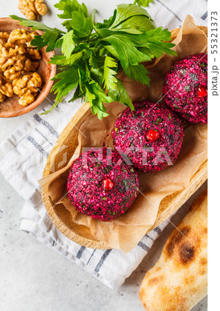 Georgian traditional beet pkhali in wooden bowl. 55321373