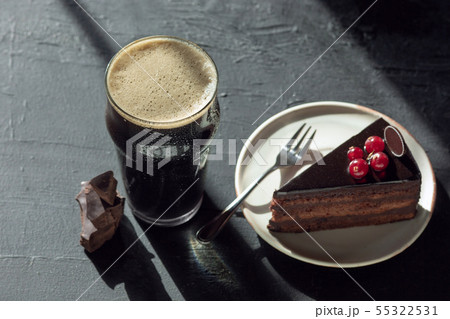 Glass of dark beer on the stone table background 55322531
