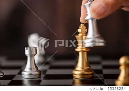 hand holding silver king attack gold leader in 55323224