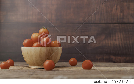 Group ripe tomato in a wood bowl place on the 55323229
