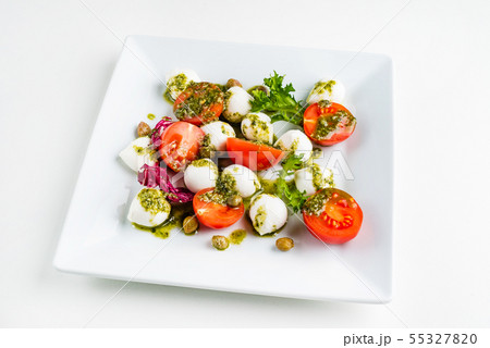 Mozzarella and tomato salad - caprese on the plate Mozzarella and tomato salad - caprese on the plate 55327820