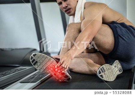 Asian man injury foot pain have a Muscle Cramp Asian man injury foot pain have a Muscle Cramp 55328088