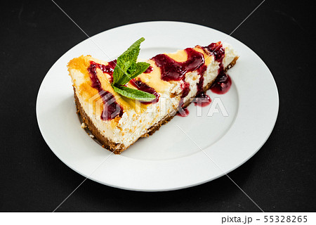 cheesecake with berry sauce 55328265