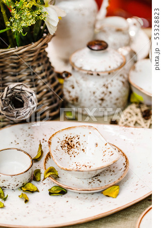 Ceramic tableware on the table Ceramic tableware on the table 55328823